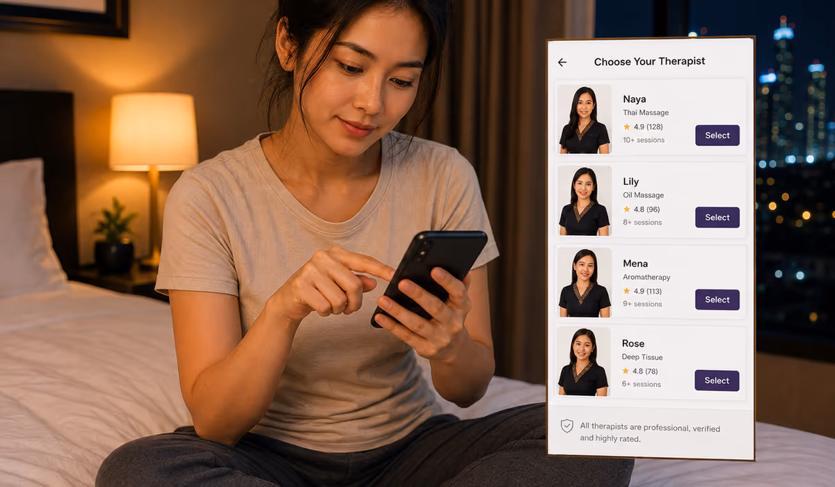 A woman sitting on her bed using her phone to choose a home massage therapist from a list of therapist profiles